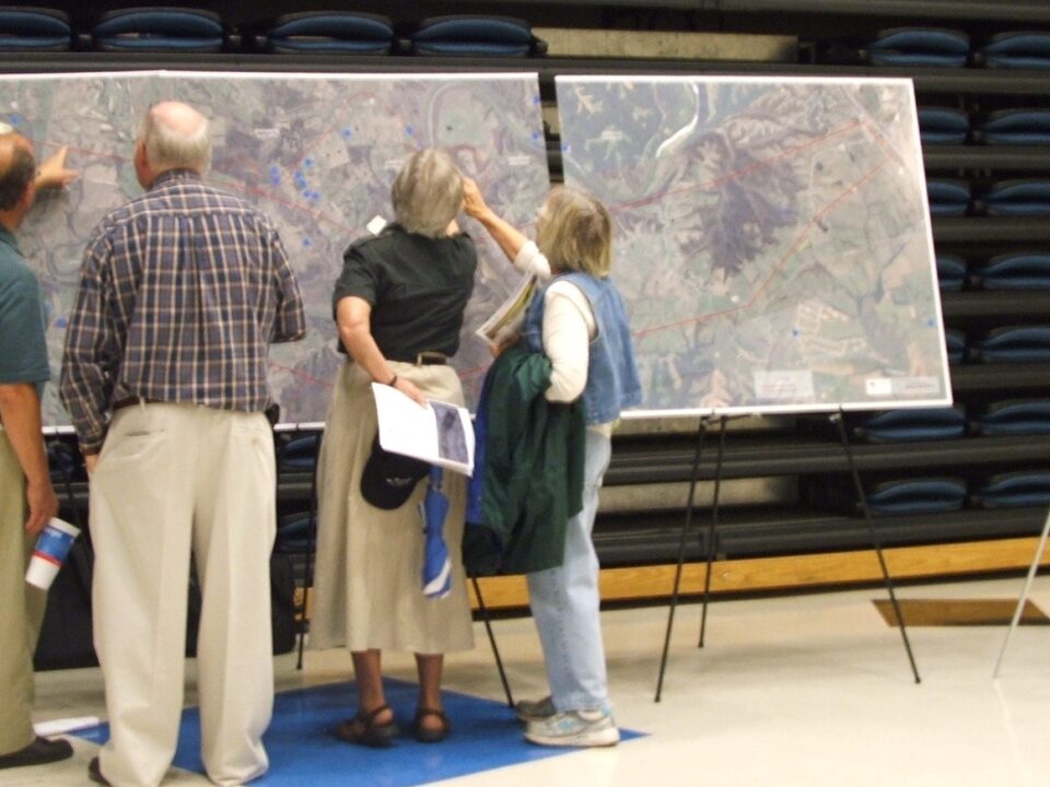 Neighbors look at possible alignments. Energy Environmental & Infrastructure Communications.
